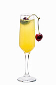 Mimosa cocktail with cherry and orange juice