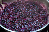 Blueberry and onion chutney in the pan
