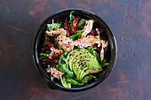 Salmon and avocado salad with sun-dried tomatoes