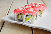 Sushi roll with tuna, cucumber and cream cheese