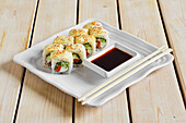 Japanese salmon rolls with cheese and sesame, soya sauce