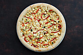 Pizza with chicken, peppers, courgette and feta cheese