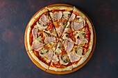 Pizza with mushrooms, ham and sausage