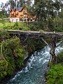 A derelict wooden bridge over the Rio Bonito in Nahuel Huapi National Park in northern Patagonia in Argentina.