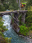 A derelict wooden bridge over the Rio Bonito in Nahuel Huapi National Park in northern Patagonia in Argentina.