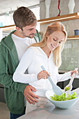 Young Couple Preparing Salad