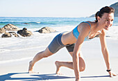 Woman Working Out on Beach