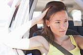 Young Woman Inside Car Wearing Seat Belt