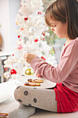 Young Girl Decorating Ginger bread man Biscuits