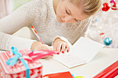Young Woman Writing Christmas Card
