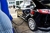 Car refueling at gasoline pump