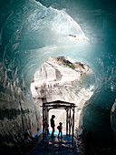 France,Haute Savoie,Chamonix,a woman and a child are standing in the icy tunnel of the cave of ice at the bottom of the Montenvers