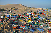Sultanate of Oman,East Coast,Indian ocean,a huge amount of multicolored plastic garbage is abandonned on a wild beach