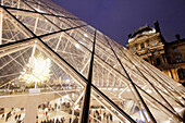 Paris. 1st district. Louvre Museum by night. The pyramid (architect: Ieoh Ming Pei). Tourists in the museum. Throne sculpture by Kohei Nawa.Mandatory credit of the architect architect: Ieoh Ming Pei