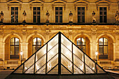 Paris. 1st district. Louvre Museum by night. Facade of the Denon Pavilion. In the foreground one of the secondary pyramids (architect: Ieoh Ming Pei). Mandatory credit of the architect architect: Ieoh Ming Pei