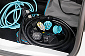 France. Seine et Marne. Electric car Renault Zoe. Close up on charging cables (classical 220v,types 2 and 3) in the car trunk,showing the complexity of cables. Cables taking up a lot of space in the trunk.