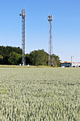France. Seine et Marne. Boissy le Chatel. Mobile telephony relay antenna towers near fields.