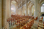 France. Normandy. Department of Manche. Coutances. Cathedral. The nave. A woman is praying in the background.