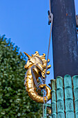 Europe,Scandinavia,Sweden. Goeteborg. Golden seahorse statue to tie the rope.