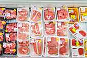 Products in a supermarket shelf. Packaged meat