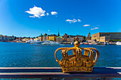 Europe,Scandinavia,Sweden. Stockholm. Old Town. Gamla Stan. Crown on Skeppsholmsbron Bridge