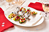 Amuse-bouche trio on stainless steel spoons