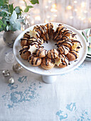 Wreath of cream puffs with chocolate icing