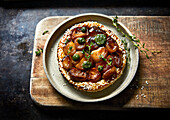 Shallot tart with herbs and sesame seeds