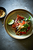 Thai skate with vegetables and lime