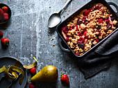 Fruity oat crumble with berries and pear