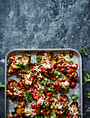 Potato skins baked with cheese and vegetables