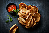 Krupuk with sweet and sour chilli sauce