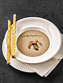 Cream of mushroom soup with garlic sticks