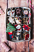 Christmas cookie selection in a cardboard box on a wooden table