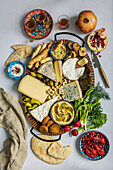 Oriental cheese platter with olives and pomegranate