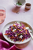 Red cabbage salad with feta and carrot strips