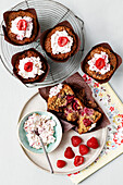 Raspberry and oat muffins with cream cheese frosting