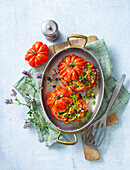 Ox heart tomatoes stuffed with couscous and courgettes