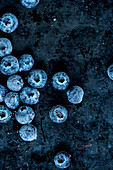 Frozen blueberries on a dark background