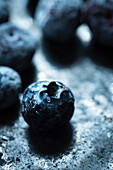 Frozen blueberries on a dark background