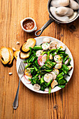 White sausage salad with radishes and wild garlic