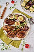 Grilled chicken drumsticks, courgettes and onions