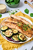 Grilled salmon with courgette and red onions