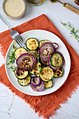 Grilled courgettes and onions with herbs