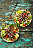 Thai beef salad with vegetables and mint