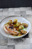 Braised pork cheek and fried mussels with potatoes