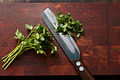 Freshly chopped parsley on a wooden board