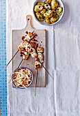 Lemon chicken skewers with herb potatoes and apple coleslaw