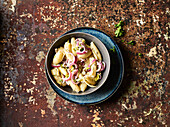 Pasta salad with red onions