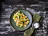 Pasta salad with Brussels sprouts, cashew nuts and herbs